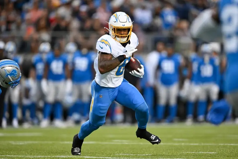 A Chargers running back carrying the football